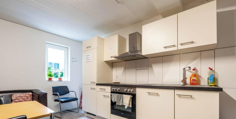 Fully equipped shared kitchen with dining area