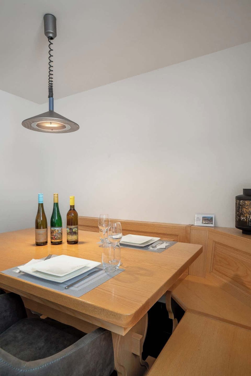 Dining nook with wooden table…
