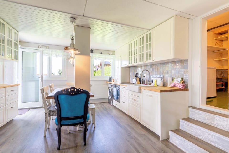 Bright open-plan kitchen and dining area with natural light