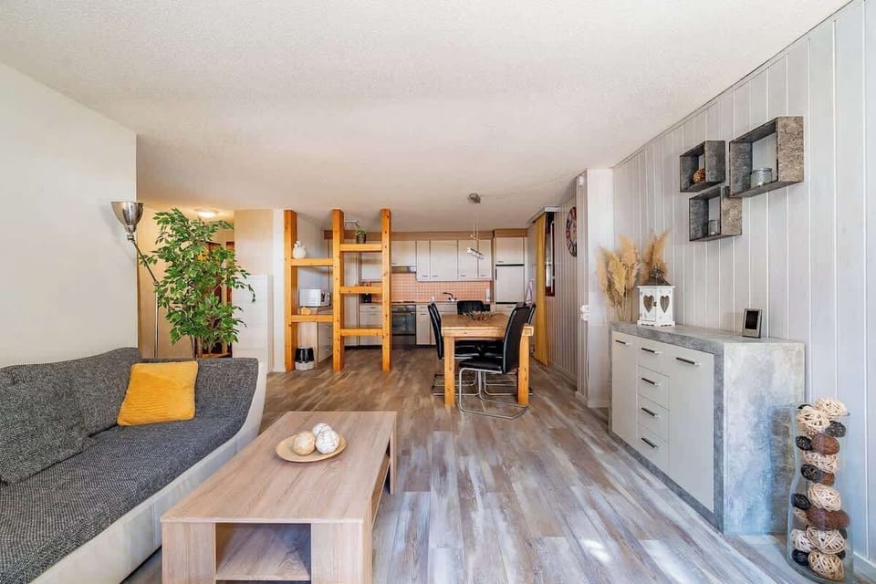 Cozy living and dining space with warm wooden elements