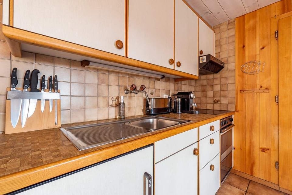 Functional kitchen setup with generous work surfaces