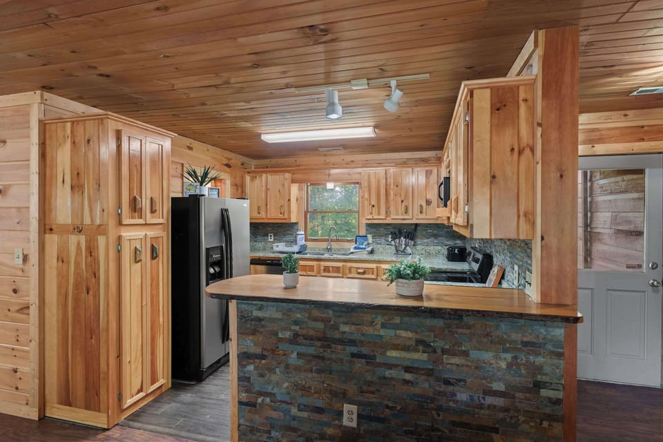 Sleek granite counters and rustic wood create a charming culinary retreat!