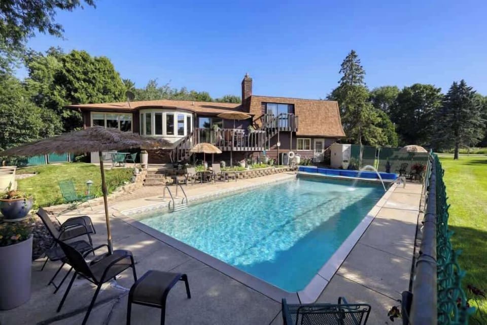 Our fenced in backyard is host to a hot tub open year round, heated pool open Memorial Day to Labor Day, lounge furniture, dining set, gas grill, pool furniture and pool toys.