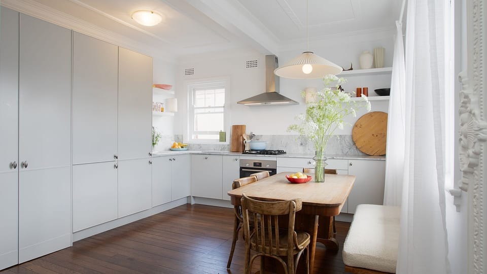 Contemporary kitchen – Sleek white cabinetry and quality finishes for effortless entertaining.