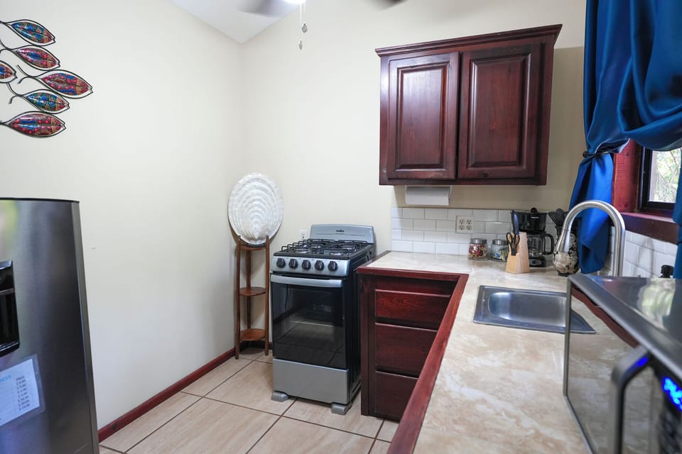 Romantic Bungalow, 1 King Bed | Private kitchen | Full-size fridge, microwave, blender, coffee grinder