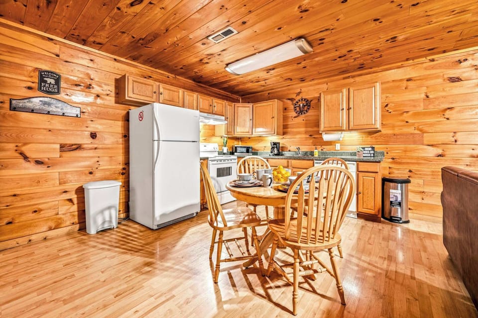 Fully stocked kitchen & cozy dining for four with washer/dryer access.