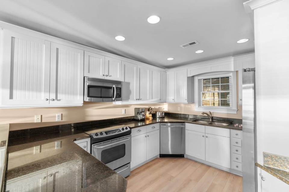 Your fully equipped kitchen features modern appliances and granite countertops, perfect for preparing meals during your stay.