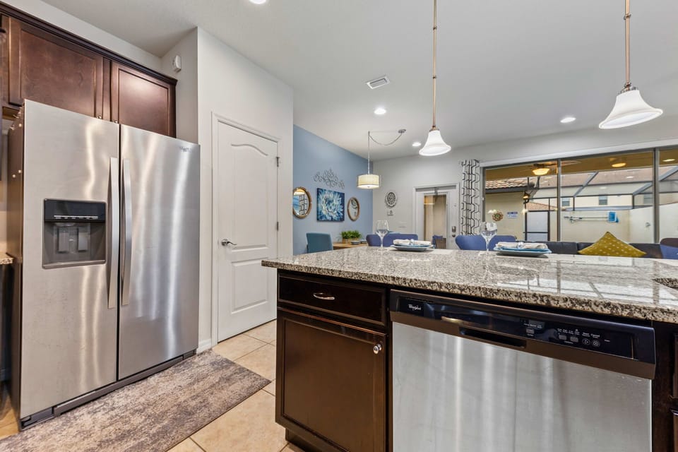 Sleek countertops paired with modern stainless steel appliances for a clean, contemporary look.