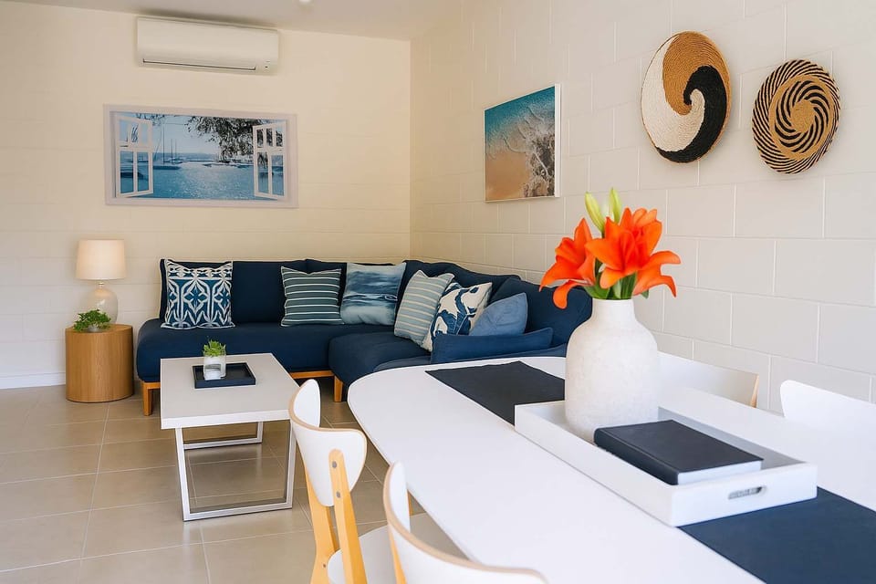 Bright open-plan living and dining area with air conditioning