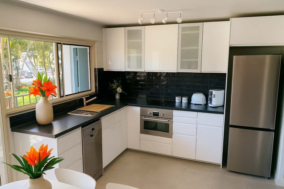 Modern fully equipped kitchen with full-size appliances