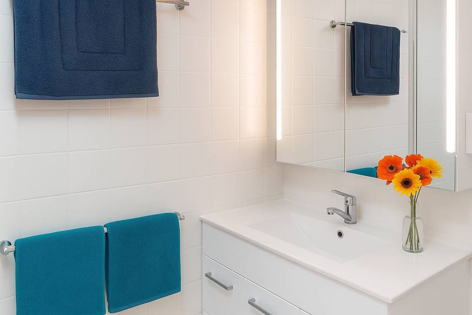 Modern Bathroom with Vanity and Fresh Towels