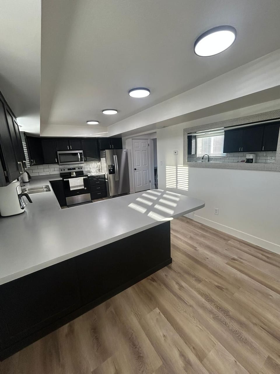 Family Townhome | Private kitchen | Full-size fridge, microwave, coffee/tea maker, toaster