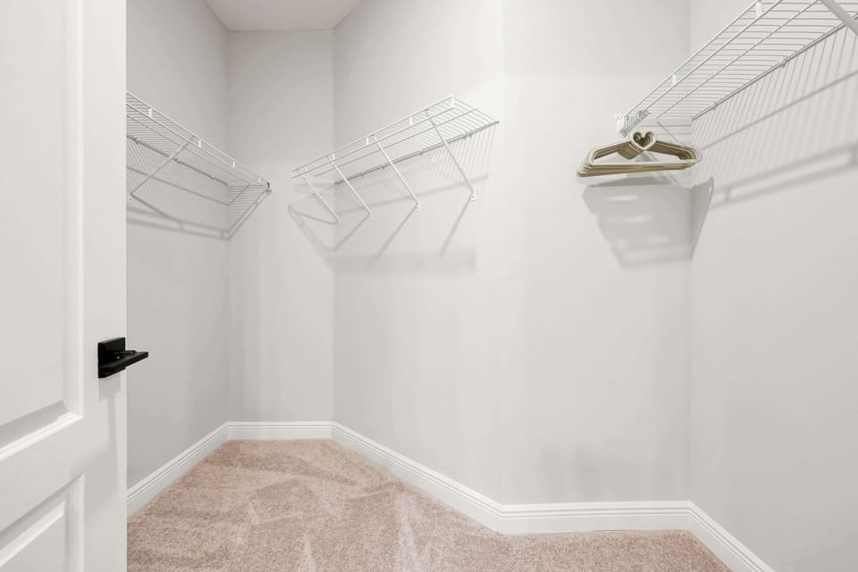 Plenty of space for your things! Unpack and settle right in with this generous walk-in closet.