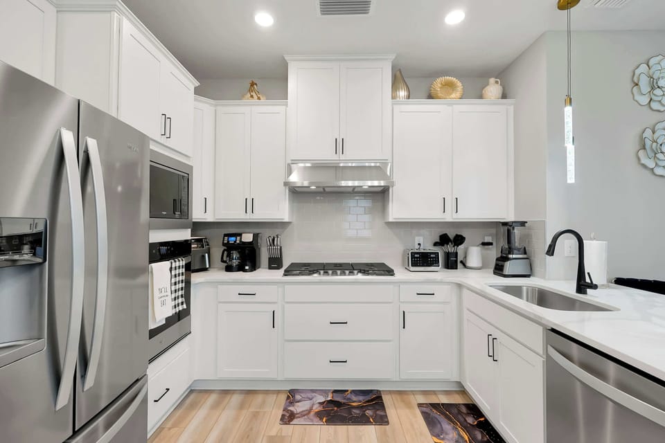 A chef's dream! 🧑‍🍳 Enjoy cooking in this bright, fully-stocked kitchen with gorgeous modern appliances.
