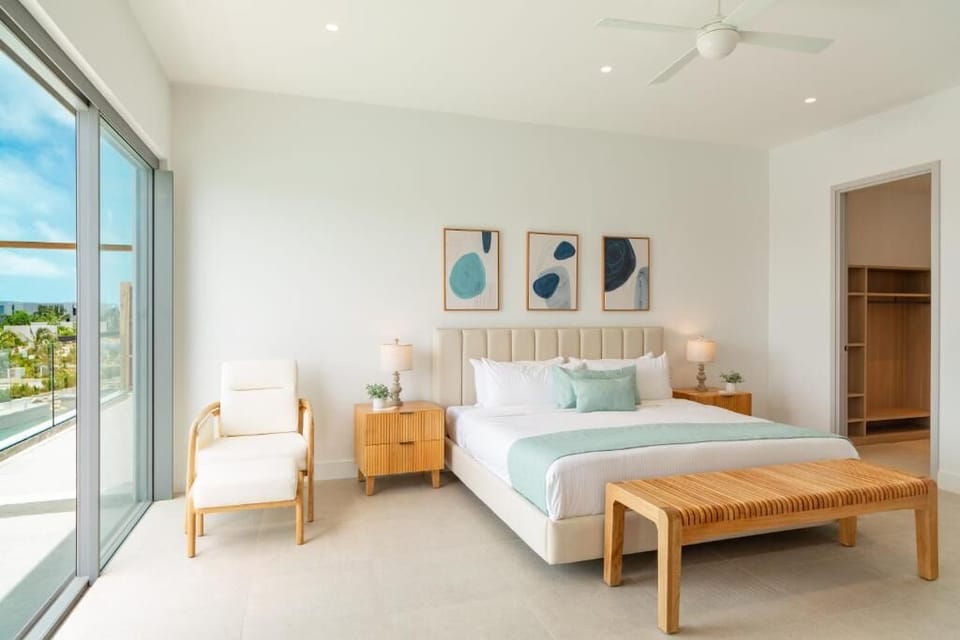 Unwind in airy comfort with balcony breezes and soft linens.