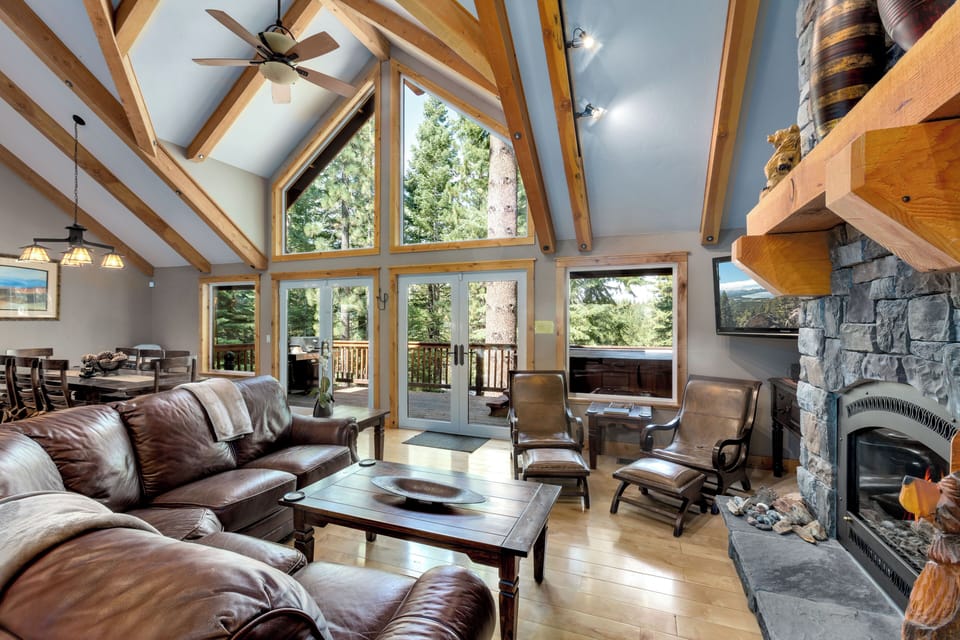 Enjoy this vaulted great room with cozy gas fireplace surrounded by soaring rock