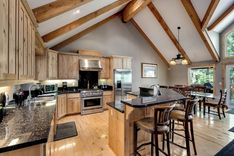 Expansive gourmet kitchen with 6-burner GE Monogram stove, Island bar seating