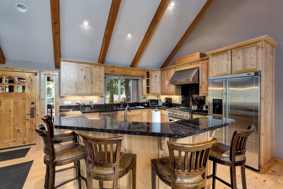 Expansive gourmet kitchen with 6-burner GE Monogram stove, Island bar seating
