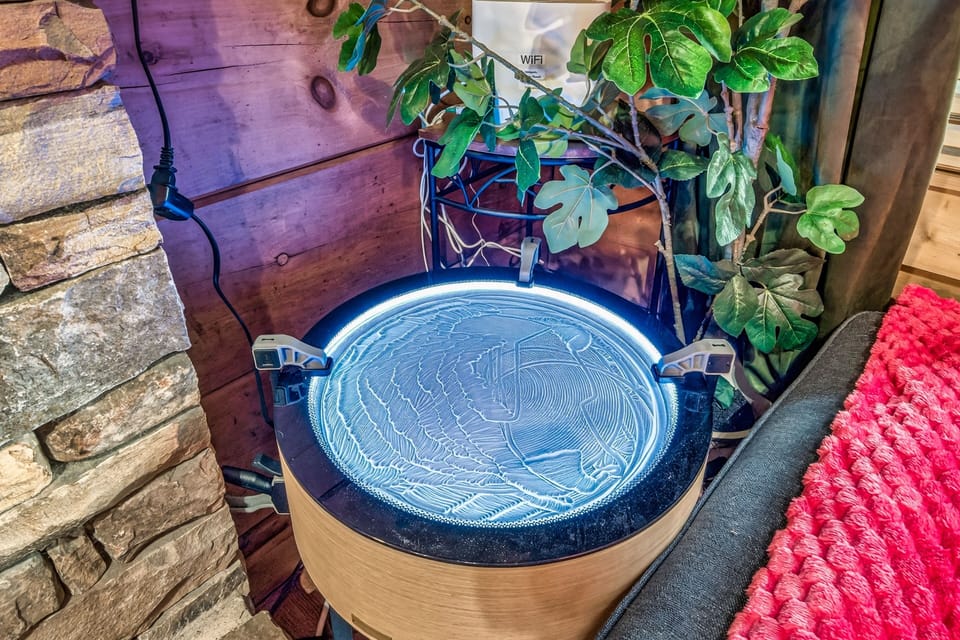 Unique illuminated sand art table adds cozy, creative ambiance