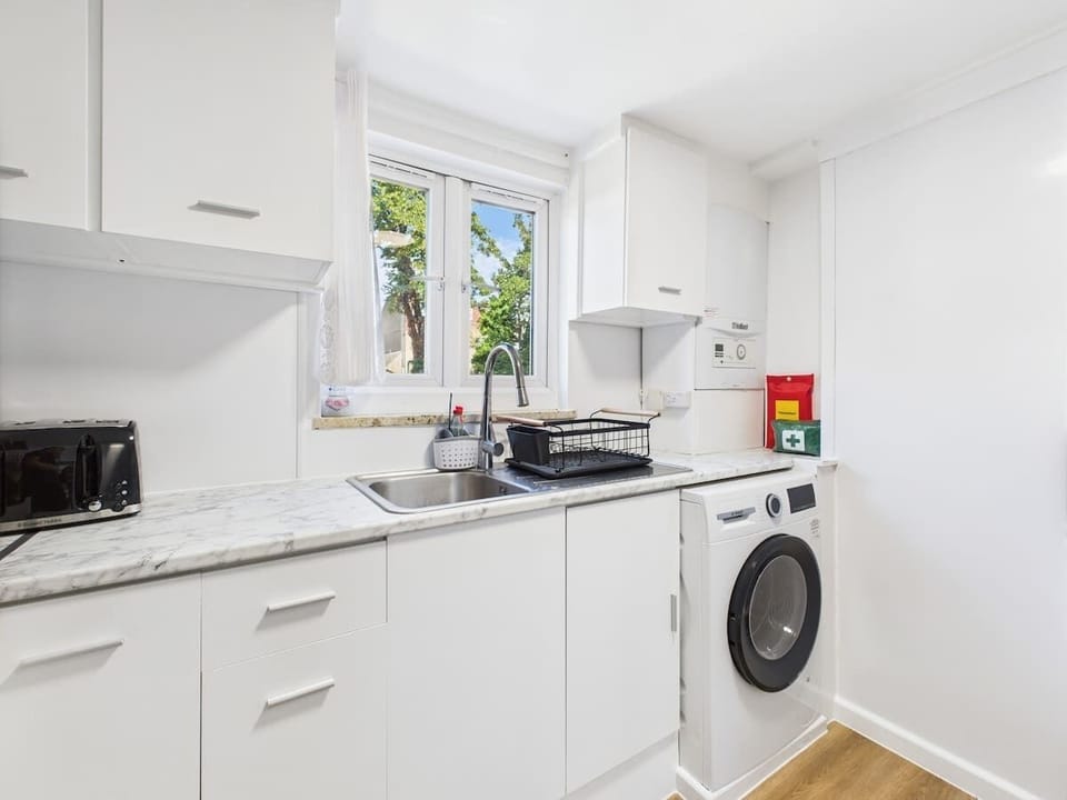Modern kitchen featuring all appliances, cookware, and utensils for easy meal prep.
D3 Short Stays