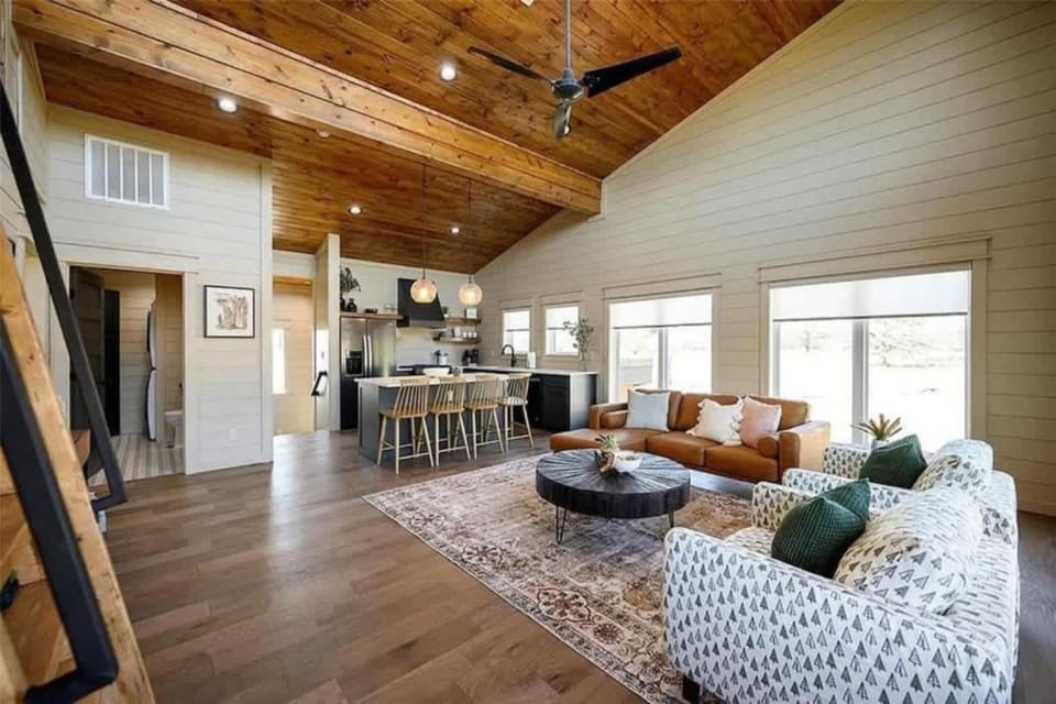 Stylish open concept living area with Smart TV and sleeper sofa 