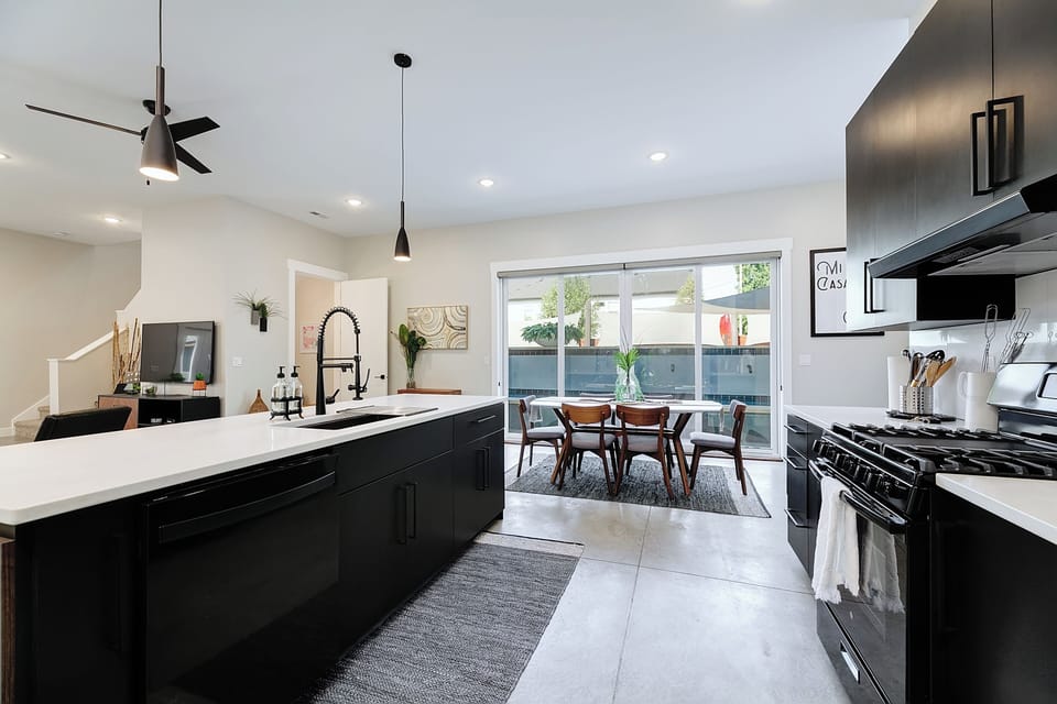 Kitchen and dining all together with beautiful outdoor views and a full wall slider leading you to the outdoor space.  