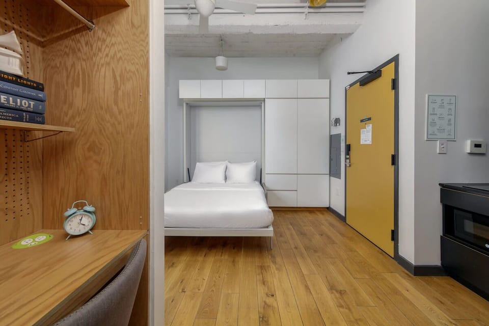 Settle into a minimalist sleep space with airy, loft-like charm.