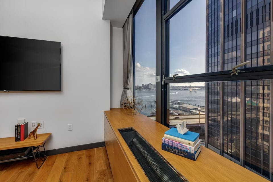 Sip coffee beside expansive windows with sweeping water views