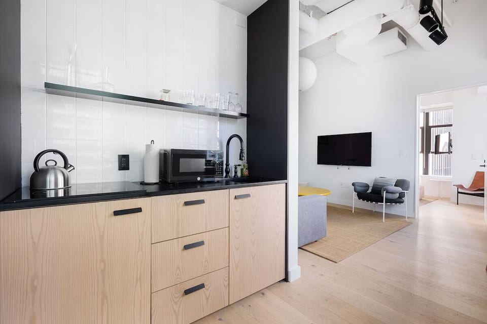 Cook and chat effortlessly in the modern open-plan kitchenette.