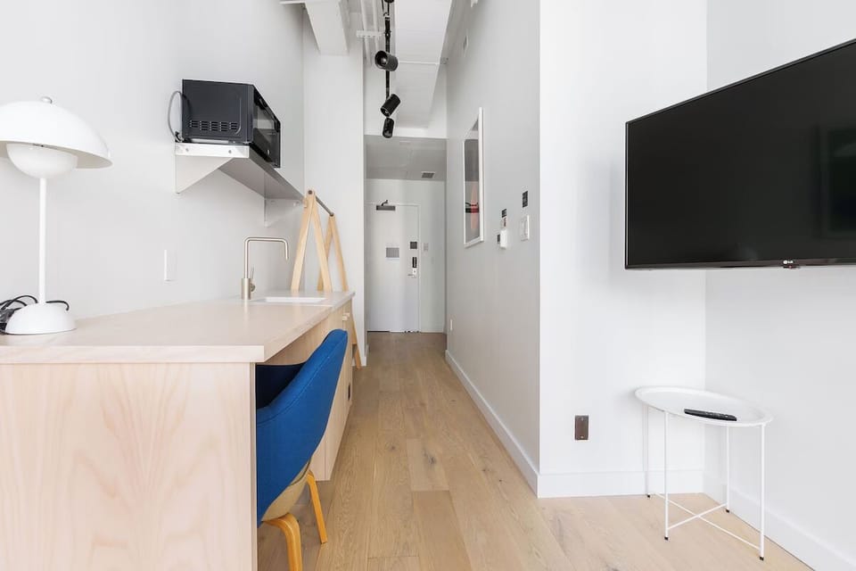 Work or dine comfortably at the counter with modern fixtures.