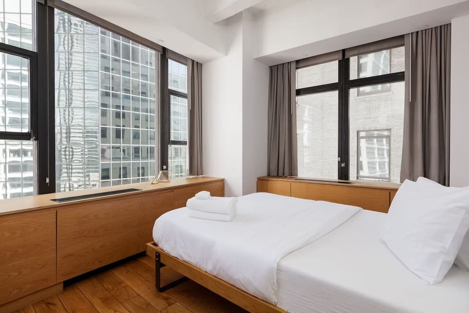 Stretch out beside oversized windows and peaceful, minimalist design.