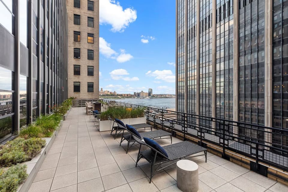 Unwind on the sunlit terrace with sweeping skyline views.