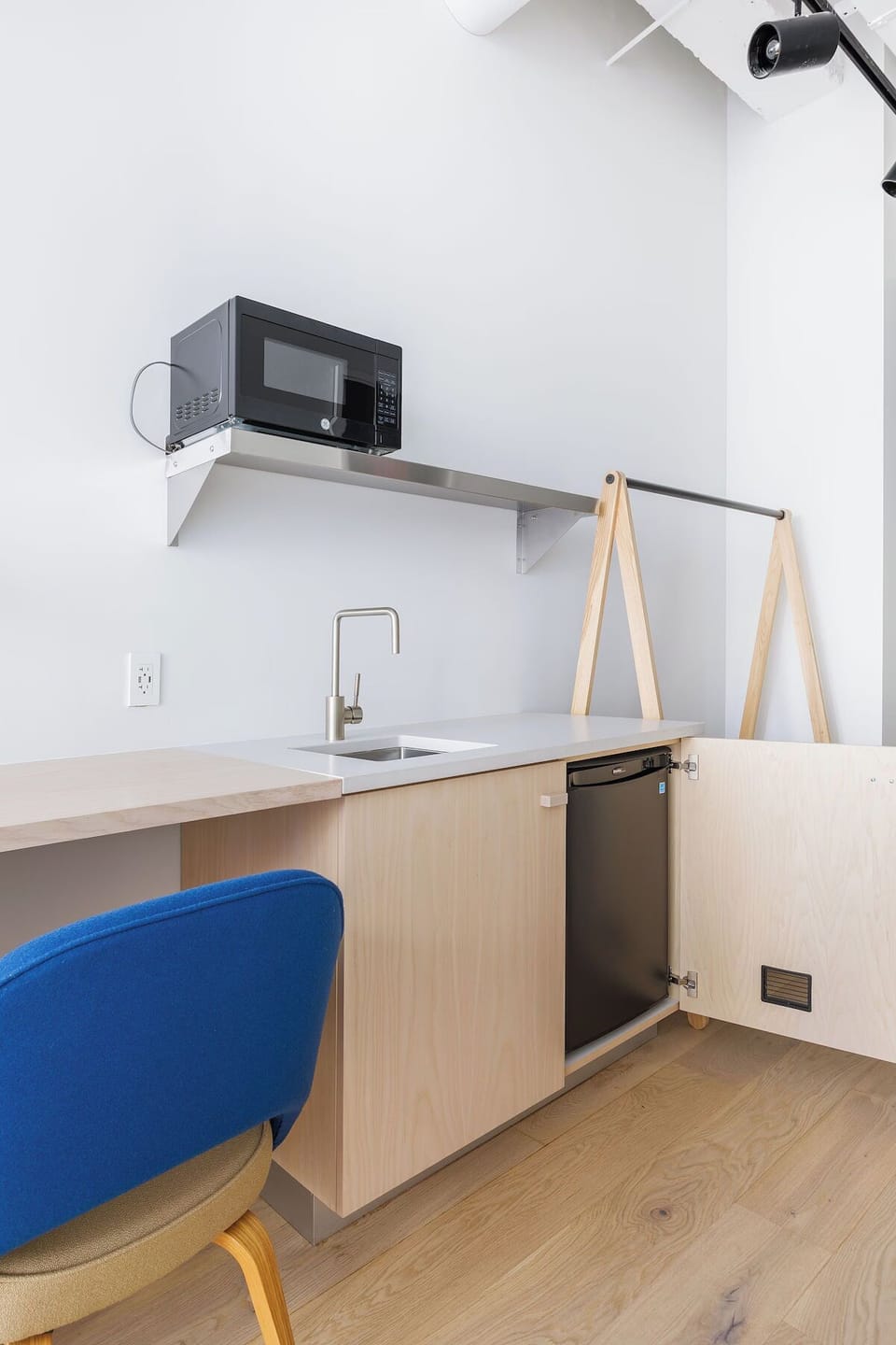 Prep quick snacks with convenient sink, fridge, and counter space.