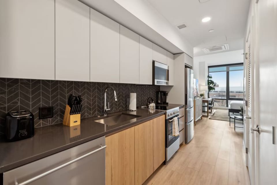 Cook with ease in a sleek, modern galley kitchen.