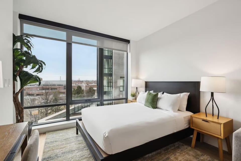 Wake up to sunshine and skyline views from bed.