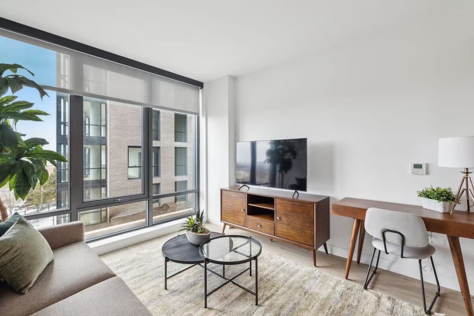 Lounge with a coffee at the desk by the window.