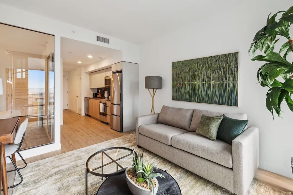 Gather comfortably in the airy living space beside the kitchen.