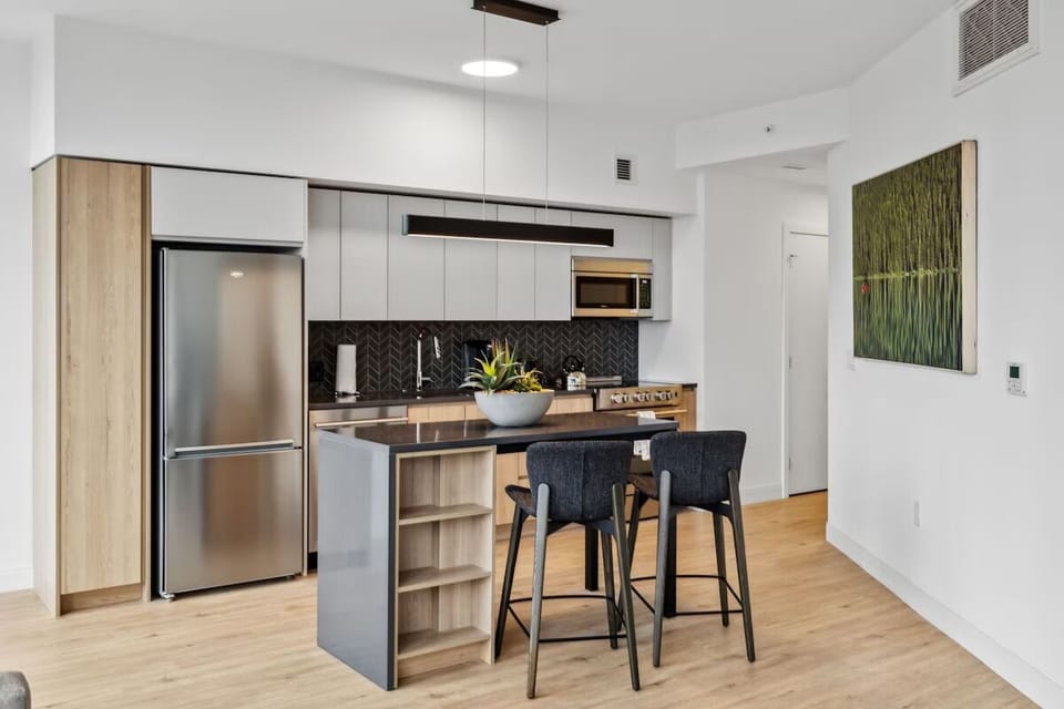 Cook effortlessly in the sleek kitchen with stainless appliances.