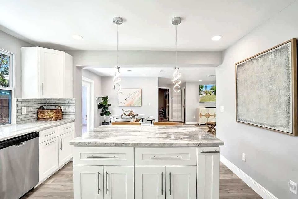 Marble kitchen island with pendant lighting