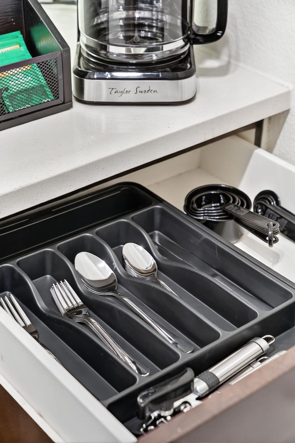 Cooking utensils and tools conveniently stored in the kitchen drawer.