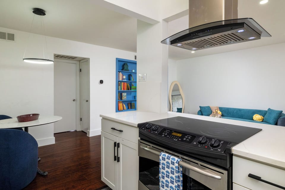 Modern kitchen w/ stainless steel appliances and stylish countertops & cabinetry