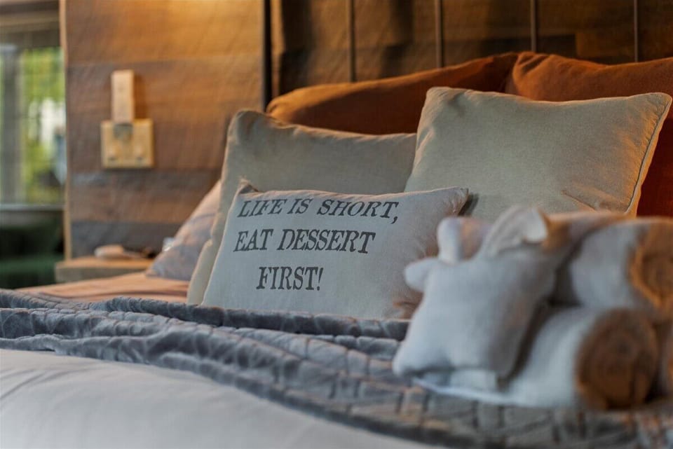 Soft linens and playful decor add a cozy and inviting touch to your restful retreat.