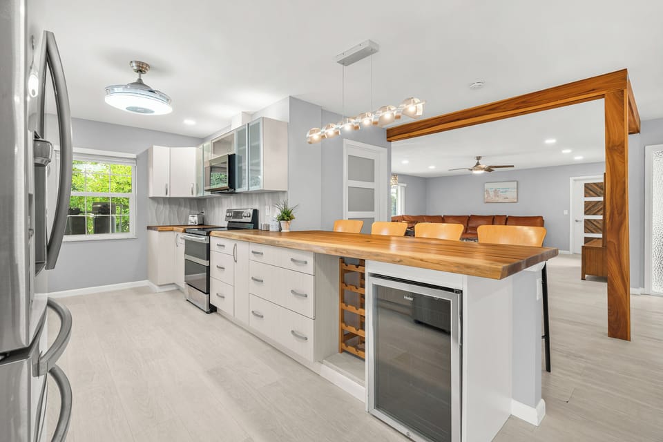 Kitchen and island layout with mini fridge to keep your drinks cold!