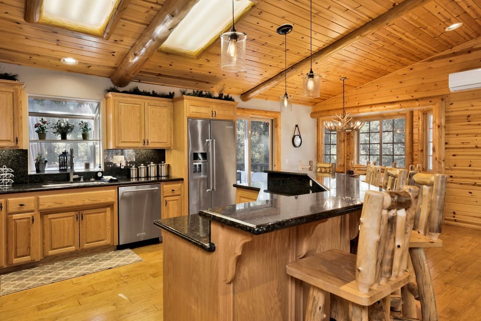 Spacious kitchen with modern appliances and ample prep space, designed for cooking full meals or hosting group dinners with ease. Everything you need for a comfortable stay.