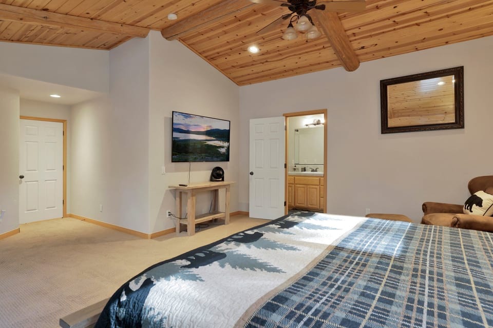 Comfortable bedroom setup with seating and TV ideal for winding down, streaming your favorite shows, or enjoying quiet downtime.