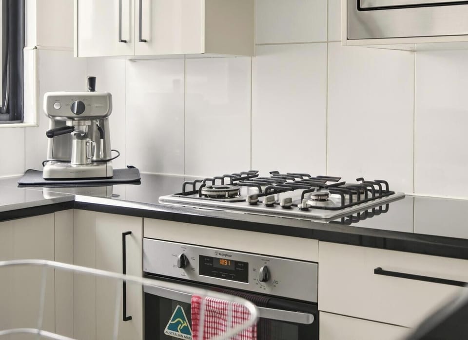 A clean, functional kitchen counter area equipped with modern appliances.