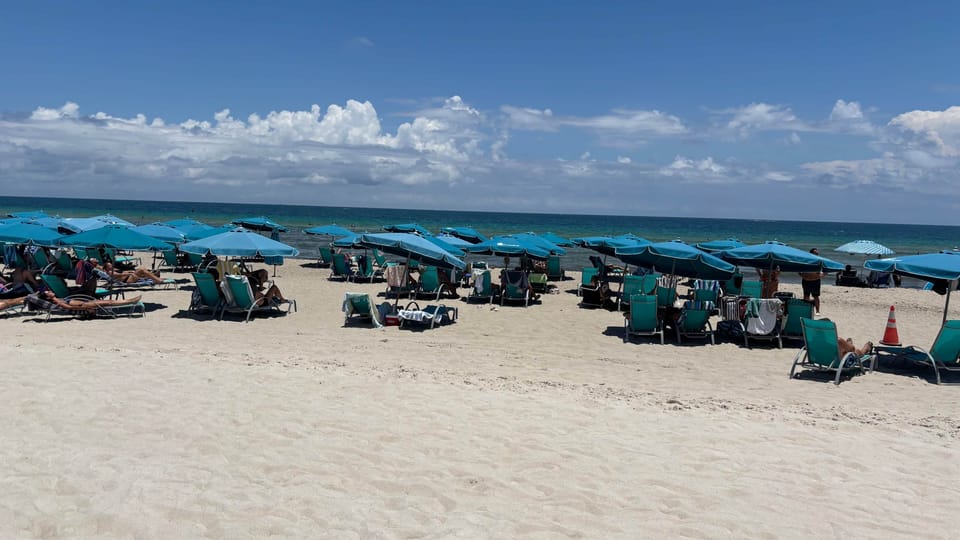 Direct beach access with lounge chairs and umbrellas steps from the condo” 🏖️
