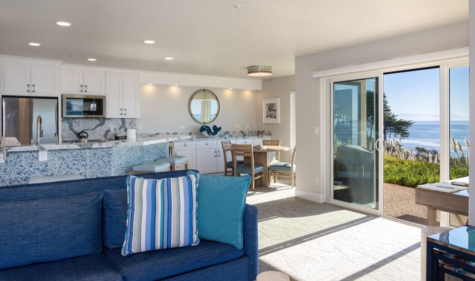 View from living room to slider, dining & kitchen