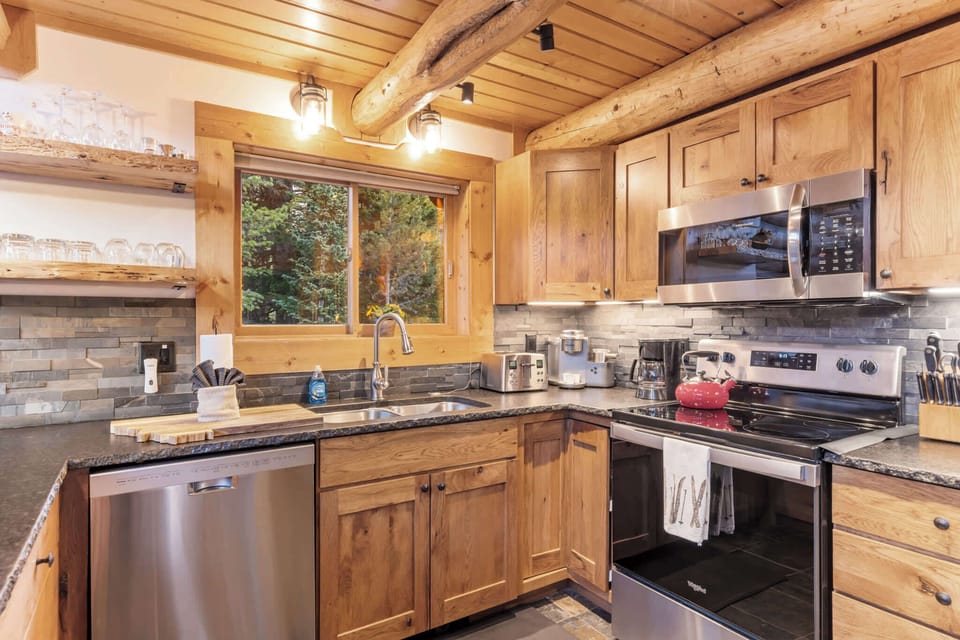 Kitchen (main floor): Drip coffee maker, Keurig, Crockpot, blender, kettle, cooking utensils, tableware