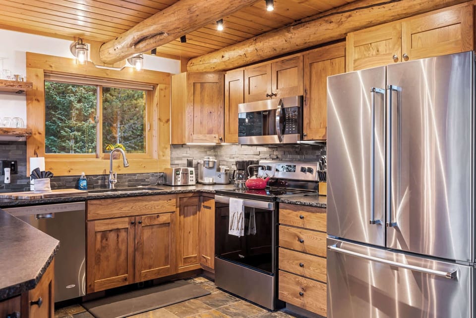 Kitchen (main floor): Drip coffee maker, Keurig, Crockpot, blender, kettle, cooking utensils, tableware